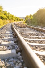 Railway tracks in a sunny and green environment, Hermann Hessebahn construction site, Calw, Germany