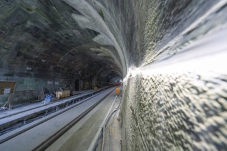 Close-up on the wall of an illuminated tunnel in a dynamic perspective, construction of the Hermann