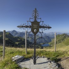 Forged memorial cross for Josef Böck, master shepherd of the rear Seealpe, behind it mountain