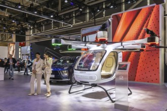 Exhibition stand of the Chinese manufacturer GAC, Guangzhou Automobile Group. Govy air taxi. Model