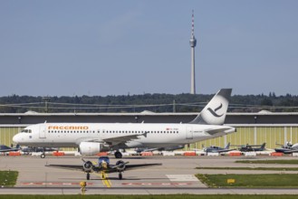 Stuttgart Airport with television tower and aeroplane. Aircraft registration number: TC-FBV,