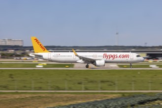 Stuttgart Airport with television tower and aeroplane on the runway. Aircraft registration number: