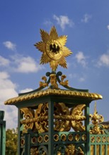 Golden star with black eagle on the fence of Charlottenburg Palace, Berlin, Germany