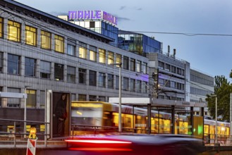 Headquarters of the automotive supplier MAHLE in the evening with the SSB tram. Bad Cannstatt,