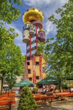 Beer garden of the Kuchlbauer brewery in front of the Kuchlbauer tower by architect Friedensreich