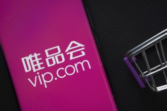 Dhaka, Bangladesh- 03 July 2025: A smartphone displaying the vip.com logo next to a miniature