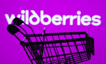 Dhaka, Bangladesh- 03 July 2025: Silhouette of a shopping cart in front of the Wildberries logo,