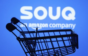 Dhaka, Bangladesh- 03 July 2025: Silhouette of a shopping cart in front of the Souq logo,