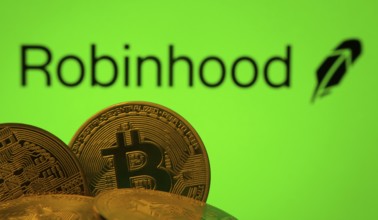 Dhaka, Bangladesh- 20 Sep 2025: Close-up of Bitcoin coins with the Robinhood Markets logo visible