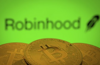 Dhaka, Bangladesh- 20 Sep 2025: Close-up of Bitcoin coins with the Robinhood Markets logo visible