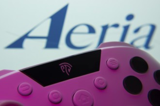 Dhaka, Bangladesh- 23 Sep 2025: A close-up of a gamepad with the Aeria seen on screen in the