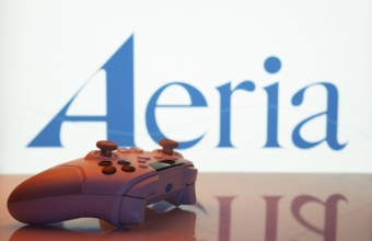 Dhaka, Bangladesh- 23 Sep 2025: Game controller in front of Aeria logo on a background