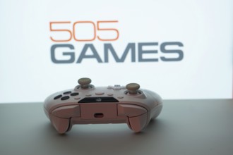 Dhaka, Bangladesh- 23 Sep 2025: Game controller in front of 505 Games logo on a background