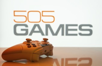 Dhaka, Bangladesh- 23 Sep 2025: Game controller in front of 505 Games logo on a background