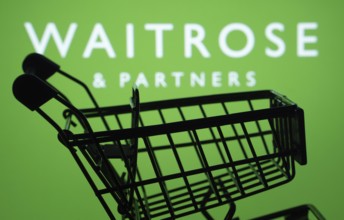 Dhaka, Bangladesh- 03 July 2025: Silhouette of a shopping cart in front of the Waitrose & Partners