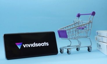 Dhaka, Bangladesh- 03 July 2025: Smartphone with VividSeats logo next to a small shopping cart and