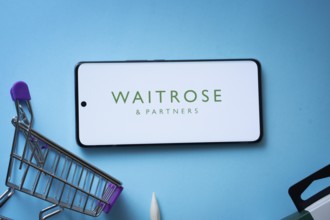 Dhaka, Bangladesh- 03 July 2025: Smartphone displaying Waitrose & Partners logo with shopping cart