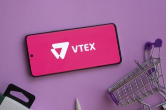 Dhaka, Bangladesh- 03 July 2025: Smartphone displaying VTEX logo alongside a shopping cart on a