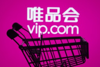Dhaka, Bangladesh- 03 July 2025: Silhouette of a shopping cart in front of the Vip.com logo,