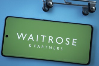 Dhaka, Bangladesh- 03 July 2025: Smartphone screen showing the Waitrose & Partners logo with