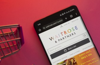 Dhaka, Bangladesh- 23 June 2025: A smartphone displaying the Waitrose & Partners website with a