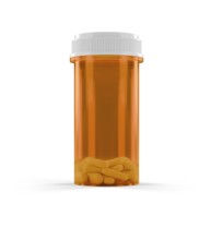 Blank prescription medicine bottle and pills isolated on a white background
