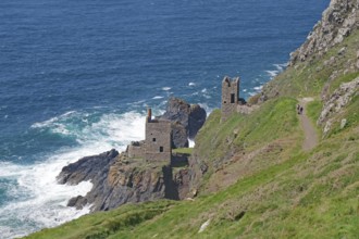 Ruins on craggy cliffs offer breathtaking views of the turbulent sea below, engine room of an old