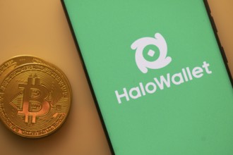 A Bitcoin and HaloWallet logo on a green screen representing cryptocurrency