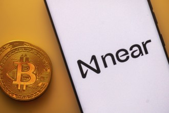 A Bitcoin coin next to a Near logo on a white background