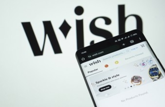 Dhaka, Bangladesh- 03 July 2025: Smartphone displaying Wish web interface against wish logo