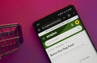 Dhaka, Bangladesh- 23 June 2025: A smartphone displaying the zooplus website with a shopping cart