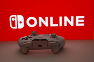Dhaka, Bangladesh- 15 July 2025: Game controller in front of nintendo online logo on a background