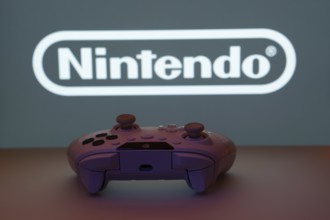 Dhaka, Bangladesh- 15 July 2025: A close-up of a gamepad with the nintendo seen on screen in the