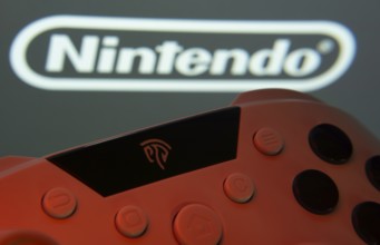 Dhaka, Bangladesh- 15 July 2025: A close-up of a gamepad with the nintendo seen on screen in the