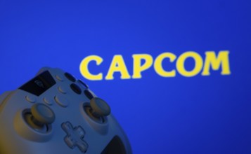 Dhaka, Bangladesh- 15 Sep 2025: A close-up of a gamepad with the Capcom seen on screen in the