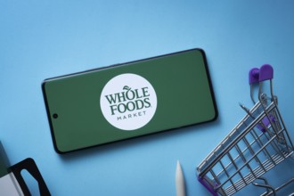 Dhaka, Bangladesh- 03 July 2025: Smartphone displaying Whole Foods Market logo with shopping cart