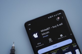 Dhaka, Bangladesh- 29 May 2025: On a blue surface, a smartphone displays the Whitebit app within