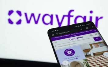 Dhaka, Bangladesh- 03 July 2025: Smartphone displaying Wayfair web interface against Wayfair logo