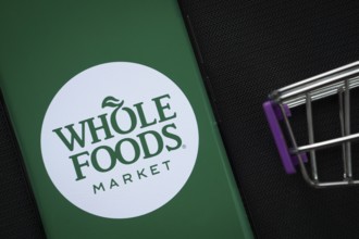 Dhaka, Bangladesh- 03 July 2025: A smartphone displaying the Whole Foods Market logo next to a