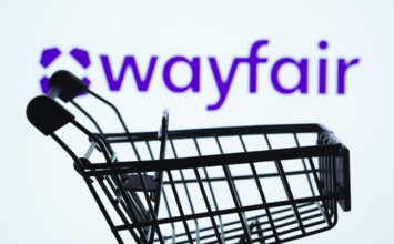 Dhaka, Bangladesh- 03 July 2025: Silhouette of a shopping cart in front of the Wayfair logo,