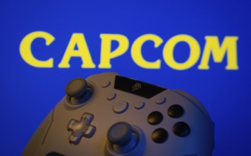 Dhaka, Bangladesh- 15 Sep 2025: A close-up of a gamepad with the Capcom seen on screen in the