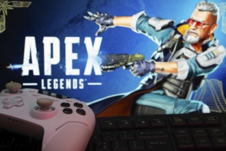 Dhaka, Bangladesh- 19 Sep 2025: A close-up of a white gamepad with the Apex Legends seen on screen