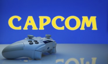 Dhaka, Bangladesh- 19 Sep 2025: A close-up of a white gamepad with the Capcom seen on screen in the