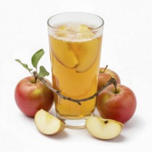A glass of apple juice is surrounded by fresh red apples and apple slices, creating a vibrant and