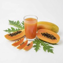 A refreshing glass of papaya juice is presented alongside sliced papaya fruit and vibrant green