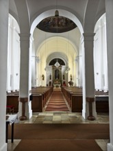 Interior view of a church with altar, arches and wooden pews, Kammersdorf Hollabrunn Weinviertel