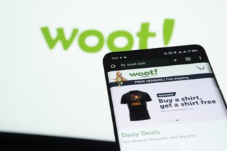 Dhaka, Bangladesh- 03 July 2025: Smartphone displaying Woot web interface against woot logo