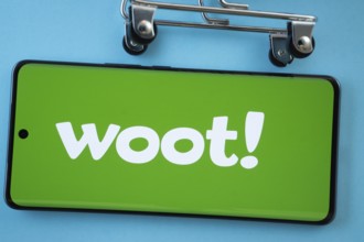 Dhaka, Bangladesh- 03 July 2025: Smartphone screen showing the Woot logo with shopping cart wheels