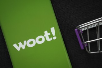 Dhaka, Bangladesh- 03 July 2025: A smartphone displaying the Woot logo next to a miniature shopping