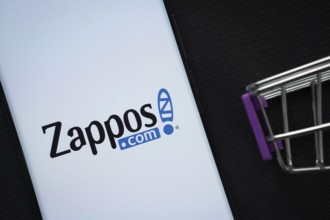 Dhaka, Bangladesh- 03 July 2025: A smartphone displaying the Zappos logo next to a miniature